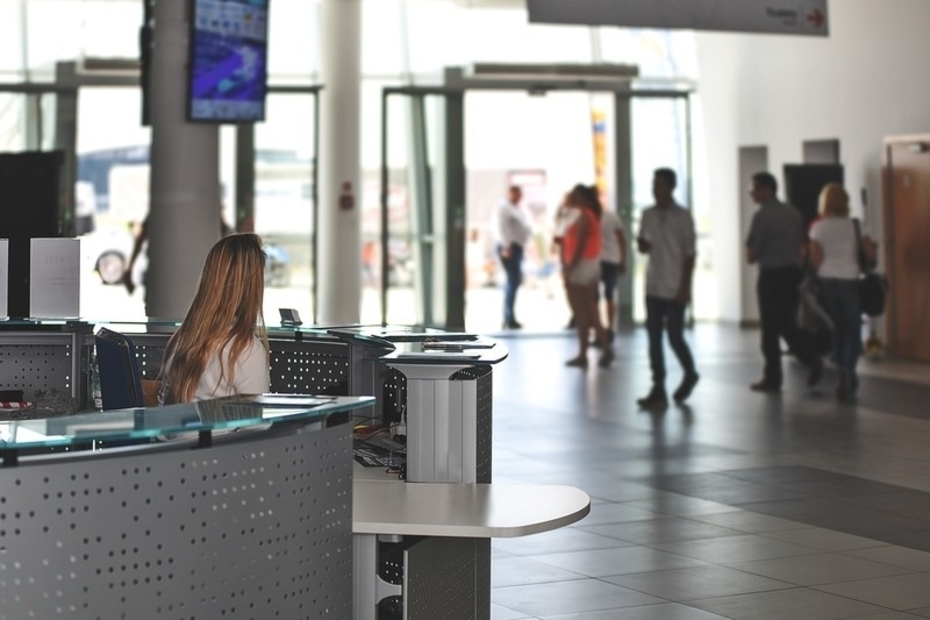 A woman sitting at an Office Reception Desk